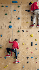 Children rock climbing at indoor facility in Izhevsk, Russia