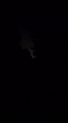 Nighttime highway scene with semi-truck captured on video