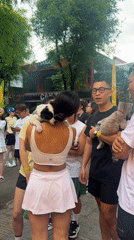 Late-night café gathering features pet-carrying patrons in Thủ Đức