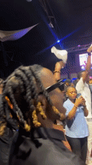 Live indoor event draws a dancing crowd in Ado, Nigeria