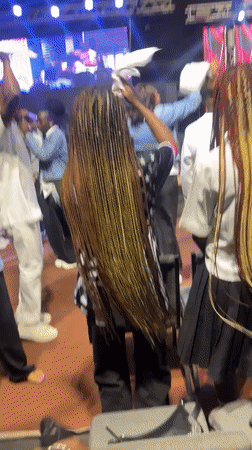 Live indoor event draws a dancing crowd in Ado, Nigeria