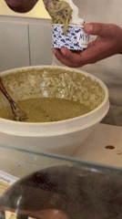 Person serves green-topped frozen yogurt in Puebla, Mexico