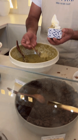 Person serves green-topped frozen yogurt in Puebla, Mexico