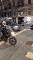 Night traffic around an ornate Saint Petersburg street corner