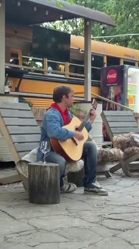 Street musician performs acoustic set in Shakhty, Russia