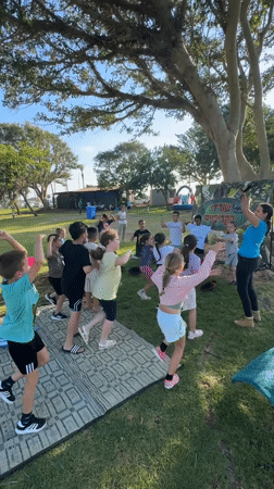 Kids' party in a Netanya park with inflatables, games, and face paint