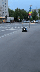 Yandex delivery robot crosses Moscow street