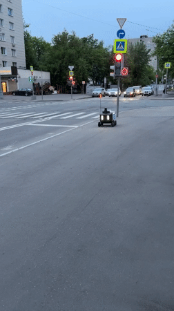 Yandex delivery robot crosses Moscow street