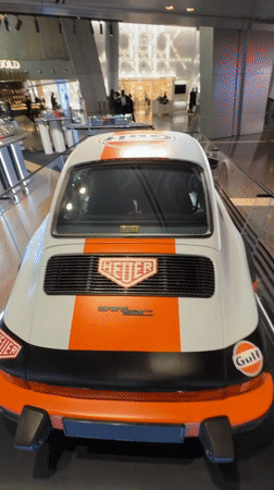 Gulf-liveried Porsche 911 on display amid Doha retail and art