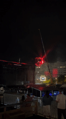 Suspended cube installation at nighttime Porto concert