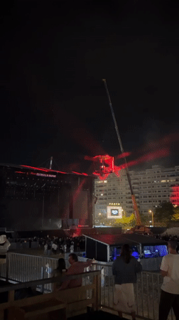 Suspended cube installation at nighttime Porto concert