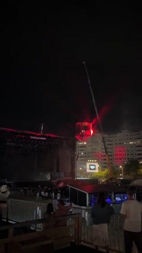 Suspended cube installation at nighttime Porto concert