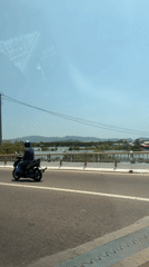 Motorcyclist spotted on bridge in Quy Nhon, Vietnam