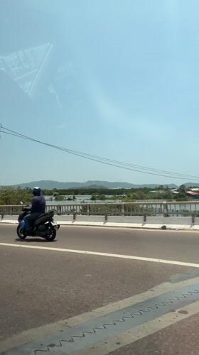 Motorcyclist spotted on bridge in Quy Nhon, Vietnam