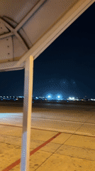 Nighttime AirAsia boarding operations documented at Bangkok airport