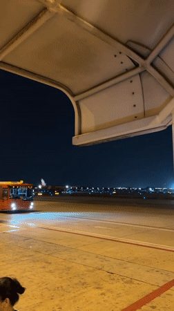 Nighttime AirAsia boarding operations documented at Bangkok airport