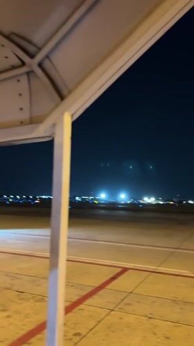 Nighttime AirAsia boarding operations documented at Bangkok airport