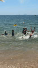 Sunny day swimming and wading at Nha Trang beach