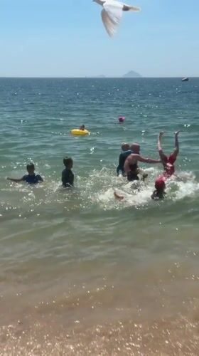 Sunny day swimming and wading at Nha Trang beach