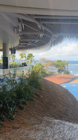 Tropical beachfront scene captured in Denpasar, Indonesia