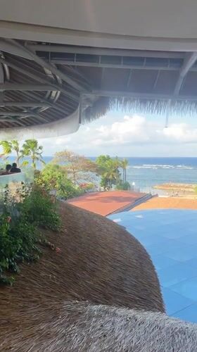 Tropical beachfront scene captured in Denpasar, Indonesia