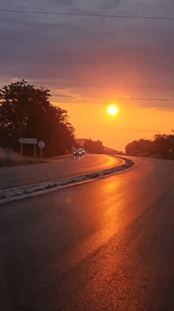 Sunset captured on curved road in Stara Zagora, Bulgaria