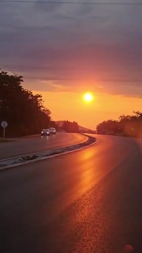 Sunset captured on curved road in Stara Zagora, Bulgaria