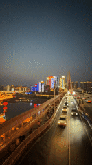 Evening traffic observed on illuminated Yuzhong District bridge