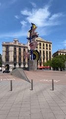 Barcelona Port Vell captures sunny morning scenes, art sculpture