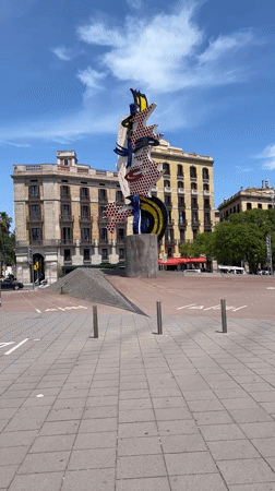 Barcelona Port Vell captures sunny morning scenes, art sculpture
