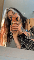 Woman takes mirror selfies in Trebesin, Montenegro