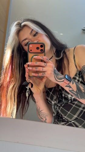 Woman takes mirror selfies in Trebesin, Montenegro