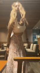 Woman dances at Pattaya Starbucks amid casual cafe atmosphere
