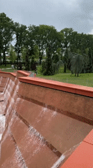 Morning park visitors document fountains and mist in Krasnodar