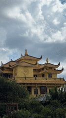 Ornate yellow Asian-style building captured in Da Lat gardens