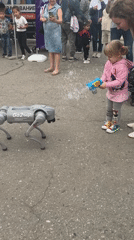 Astrakhan street festival mixes folk dance, robots, and military displays