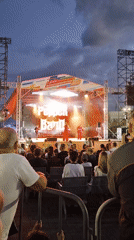 Pepper Band performs outdoor concert, singers in red take the stage