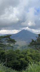 Mount Batur volcano documented under cloudy skies in Kintamani