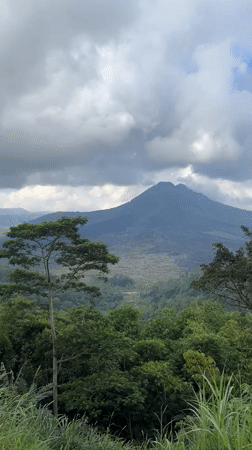 Mount Batur volcano documented under cloudy skies in Kintamani