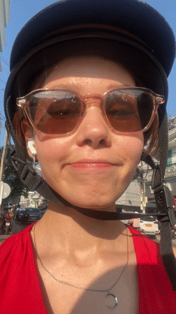 Woman records selfie video in Nha Trang urban area