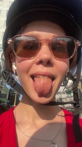 Woman records selfie video in Nha Trang urban area