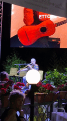Live music and street festival buzz in Tropea on a June evening