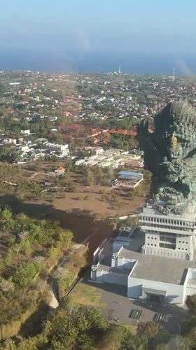 Garuda statue crowns a building rooftop in Kuta Selatan