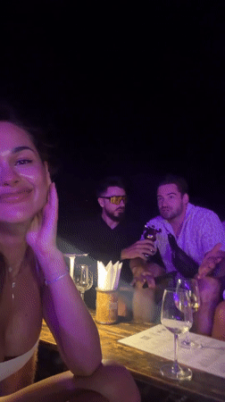 Friends gather for nighttime outdoor dinner in Choeng Thale