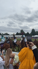 Polo match draws spectators in London under overcast skies