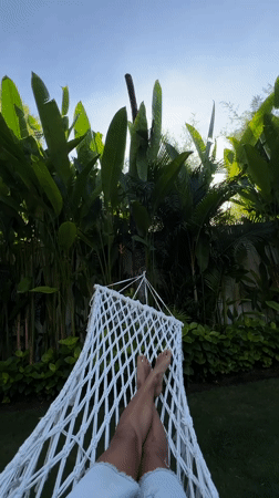 Morning relaxation in hammock captured in Kuta, Indonesia