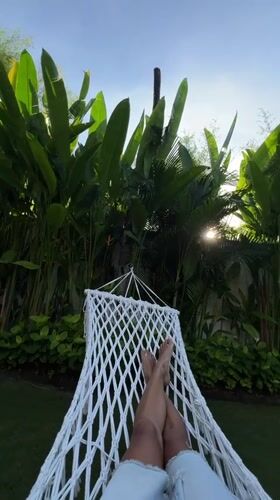 Morning relaxation in hammock captured in Kuta, Indonesia