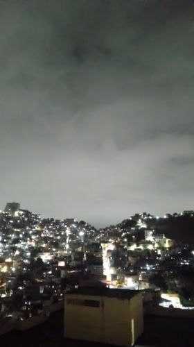 Caracas residents captured during routine nighttime urban activities