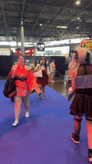 Costumed attendees and convention food at Villepinte expo center