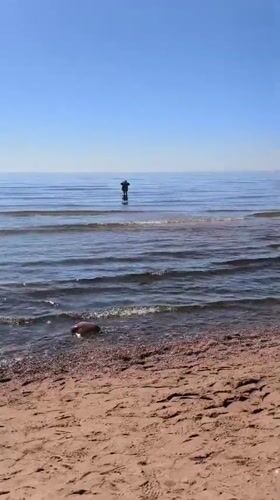 Beachgoers enjoy sunny morning at Komarovo, Russia coastline